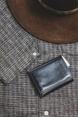 Hat and wallet lay flat on vintage shirt