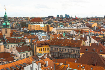 Fototapeta na wymiar Panorama of the city of Prague. The old part of the city. Beautiful roofs of shingles. Ancient buildings and churches.