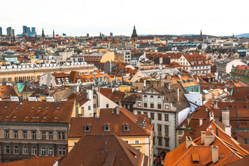 Fototapeta na wymiar Panorama of the city of Prague. The old part of the city. Beautiful roofs of shingles. Ancient buildings and churches.