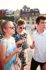Family spending time together in the city centre eating ice cream on a summer day