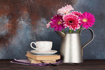 Gerbera flowers bouquet and coffee cup