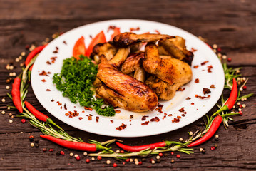Chicken wings grilled with spices and chili pepper