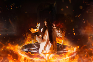 Woman sitting in burning pentagram circle, magic