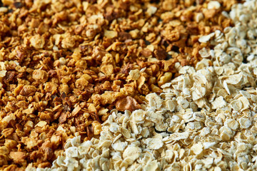 Healthy mix of granola and oatmeal on dark background, top view, close-up, selective focus