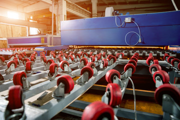 Conveyor belt for production a window pane. Industrial equipment.