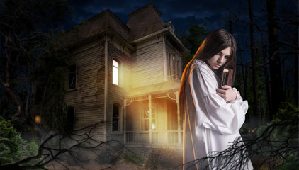 Woman with spellbook, abondoned house in the night