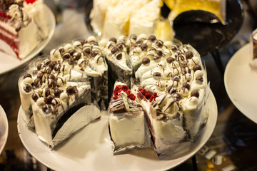 closeup white chocolate cake in bakery shop.