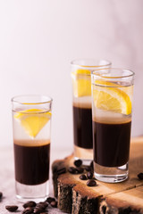 Alcoholic cocktail silver bullet with gin, coffee liqueur and lemon.