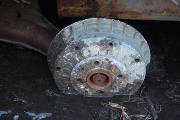 Old rusty car brake shoe in the water close