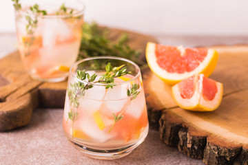 Gin bitter lemon with thyme and grapefruit. Fruit lemonade.