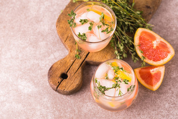 Gin bitter lemon with thyme and grapefruit. Fruit lemonade.