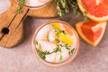 Gin bitter lemon with thyme and grapefruit. Fruit lemonade.