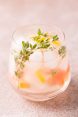 Gin bitter lemon with thyme and grapefruit. Fruit lemonade.