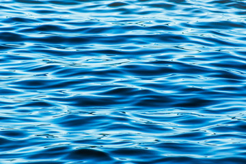 Blurred sea water texture with small waves