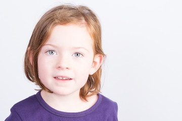 Portrait of little girl in white background