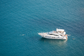 the rocky islands. high rocky cliff and boat at sea. Aerial view