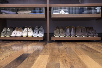 Men's shoes stand on the she