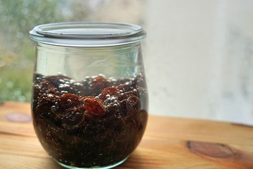 raisins in a transparent glass. soaked. for further processing
