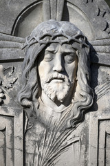 Obraz premium Figure of Jesus Christ on tombstone in little graveyard on island Brac in Croatia