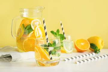 Summer detox lemonade. Water with lemon,orange, ice and mint in glass. Close up.