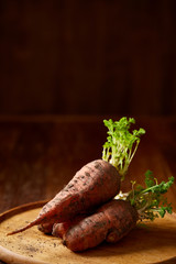 Artistically served vegetable salad with carrot, cucumber, letucce over wooden background,...