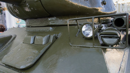 Saint-Petersburg. Russian Federation. 9 August 2017. The background is the Palace square in Day of memory and grief. The T-34 is a Soviet medium tank . A part of tank with flash light.