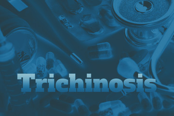 Trichinosis - diagnosis written on blue background. Set of medical devices and pills. Toning.