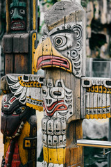 Traditional national indian totem.  Totem pole sculpture art. Ancient wooden mask.  Mayan and aztecs symbolic religious gods faces.  Ethnic pagan worship and idolatry.