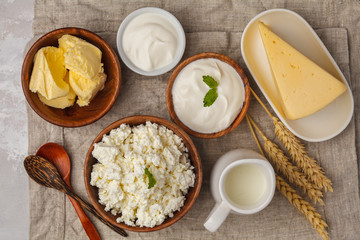 Different types of dairy products on white background, top view, copy space