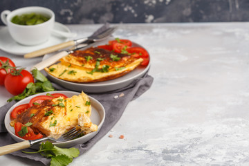 Delicious bright egg omelet with cheese and vegetables. Breakfast food concept, copy space.
