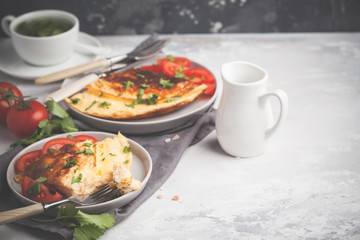 Delicious bright egg omelet with cheese and vegetables. Breakfast food concept, copy space.