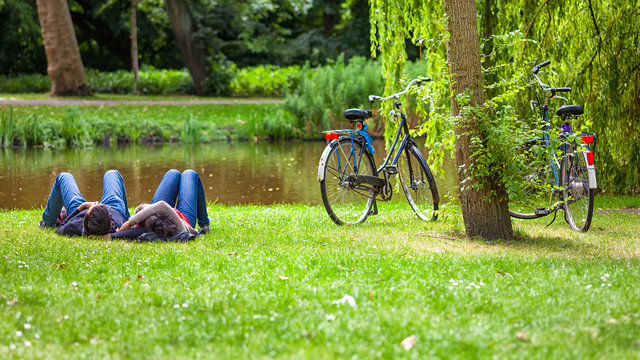 Relaxed couple on grass, Vondelpark, Amsterdam