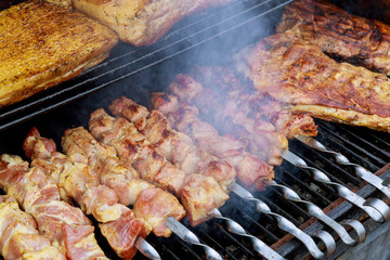 Skewers with meat on the barbecue grill