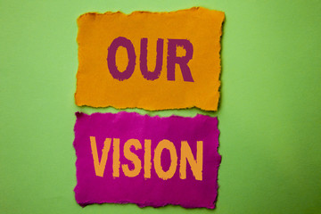Handwriting text Our Vision. Concept meaning Innovation Strategy Mission Goal Plan Dream Aim Direction written on Tear Papers on the Green background.