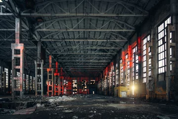 Foto op Plexiglas Large empty abandoned warehouse building or factory workshop, abstract ruins background © DedMityay