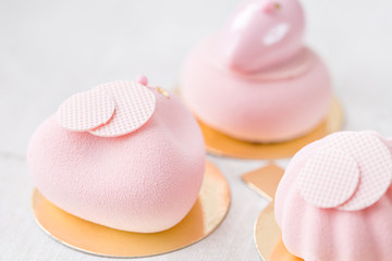 three pastel pink cake on white wooden table. Little dessert served with tea or coffee. wallpaper, Horizontal photo