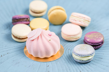 cake and macaron on blue wooden table. Macarons is French dessert served with tea or coffee. wallpaper, Horizontal photo