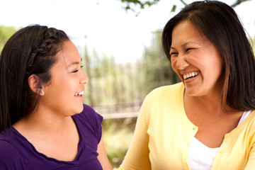 Asian teenage girl smiling.