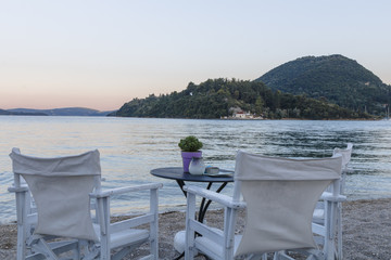 Steamers under umbrella at a tropical beach in the Mediterranean