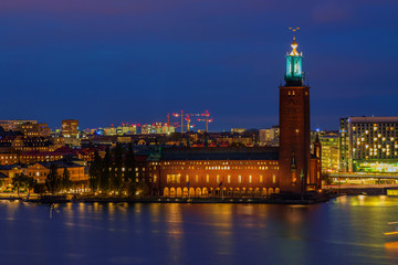 Fototapeta premium Sunset view onto City Hall, Stadshuset, in Kungsholmen island of Stockholm in Sweden