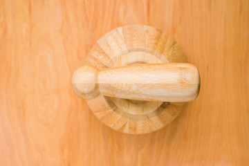 mortar upside down on wooden background