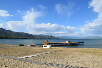 Wooden pier in Lake Prespa, beach in Stenje village. Macedonia - Albania - Greece border.