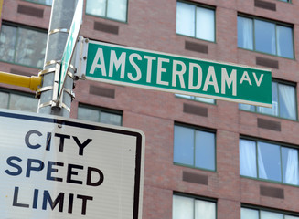 Amsterdam street sign with apartment building background, Manhattan New York