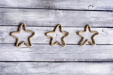 rope rustic stars on wooden background