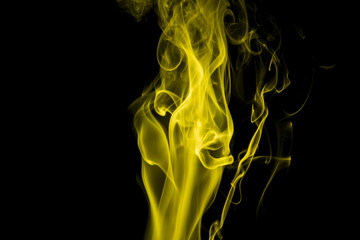 Yellow smoke on black background