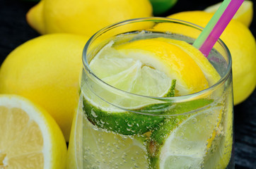 glass of water with lemon and lime