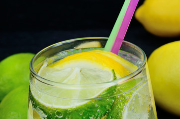 glass of water with lemon and lime