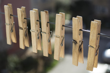wooden clothespins on a rope