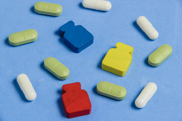 Assortment of Pills, Tablets and Capsules on Blue Table.