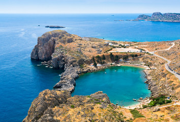 View of azure heart-shaped bay from the Acropolis of Lindos, Rhodes, Dodecanese, Greek Islands,...